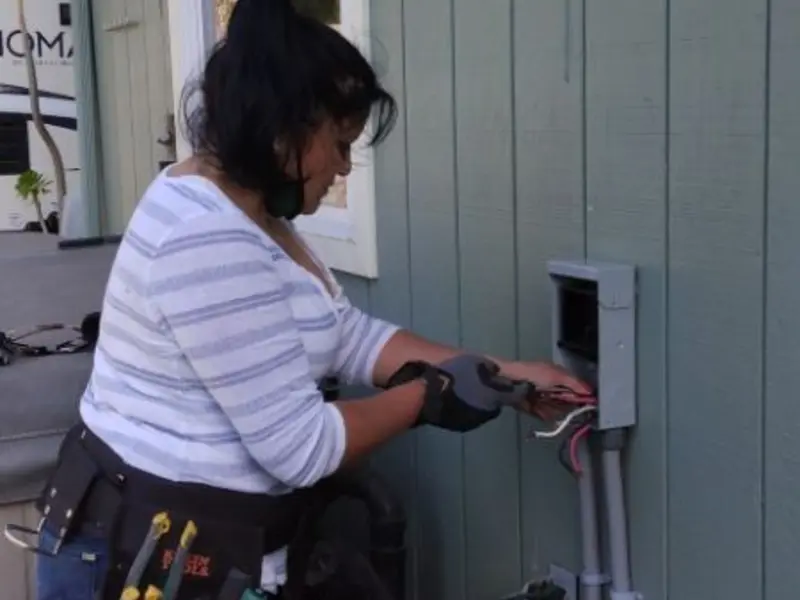 Licensed electrician wiring an exterior subpanel in Sedalia